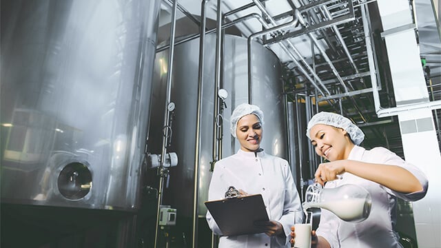 Dairy plant women milk colour corrected